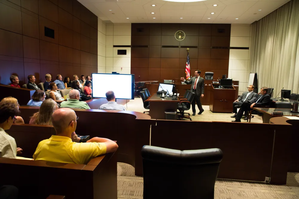 Assistant U.S. Attorney Richard Finneran lectures school teachers about financial fraud prosecutions. Assistant U.S. Attorney Richard Finneran lectures school teachers about financial fraud prosecutions.